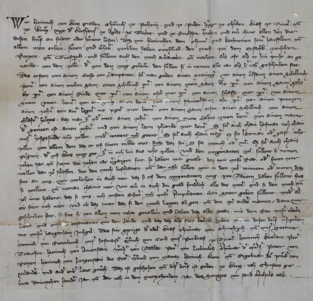 Documento archivistico: Il duca Enrico di Carinzia concede a Heinrich Kunter e alla moglie Katharina per dieci anni i concernenti la mulattiera costruita nella gola dell’Isarco tra Bolzano e Colma (Trostperch) con il relativo dazio doganale. Sigla: Archivio provinciale di Bolzano, fondo Staffler, perg. n. 65 [olim v24] 1314 settembre 22